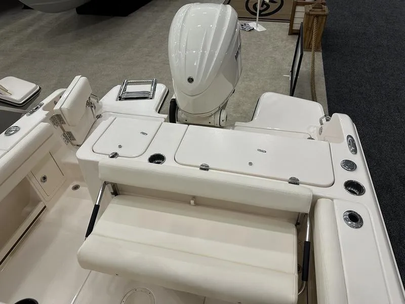 Slide: The Image of 2025 Grady-White Fisherman 236 boat interior with seating and engine view. - 7
