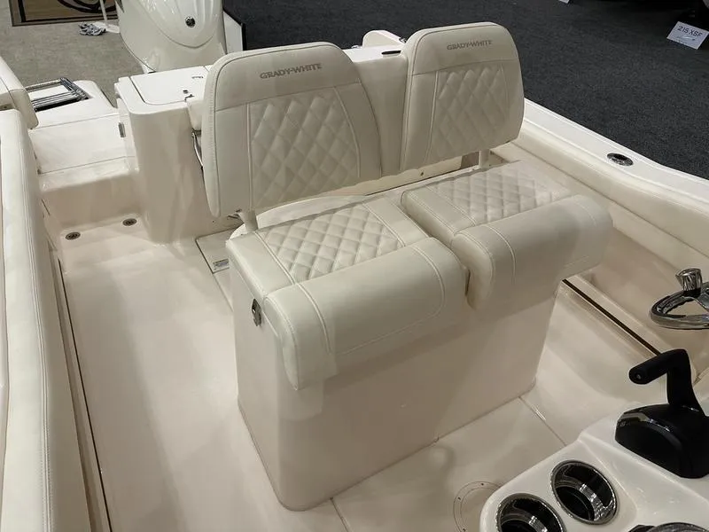 Slide: The Image of 2025 Grady-White Fisherman 236 boat interior with cushioned seating and cup holders. - 8