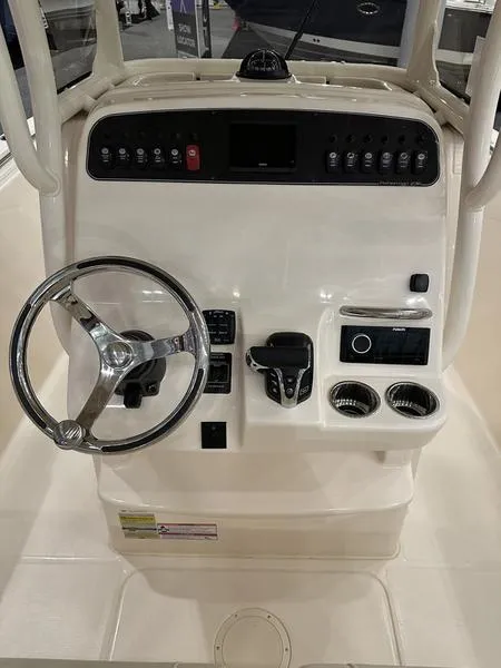 Slide: The Image of 2025 Grady-White Fisherman 236 boat console with steering wheel and control panel. - 9