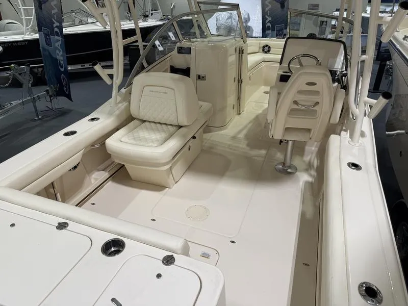 Slide: The Image of 2025 Grady-White Freedom 235 boat interior with seating and helm. - 4