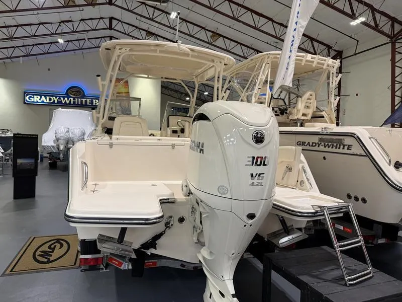 Slide: The Image of 2025 Grady-White Freedom 235 boat with Yamaha 300 V6 engine in showroom. - 5