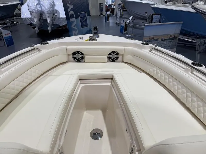 Slide: The Image of 2025 Grady-White Freedom 235 boat interior with luxurious seating and modern design. - 7