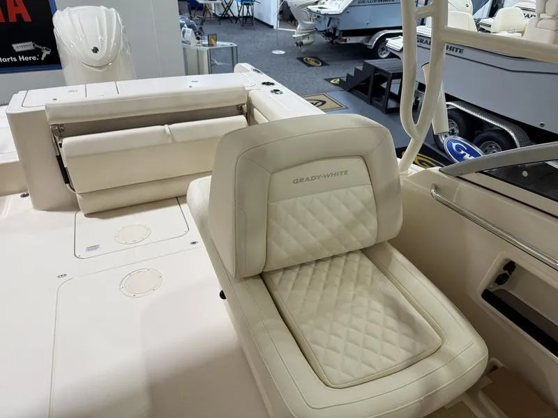 Slide: The Image of 2025 Grady-White Freedom 235 boat interior with luxurious seating and modern design. - 8