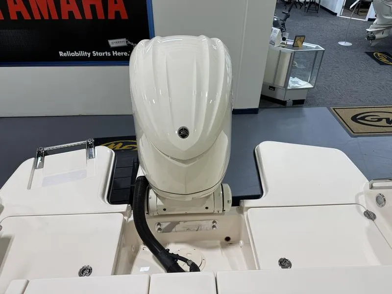 Slide: The Image of 2025 Grady-White Freedom 235 boat with Yamaha outboard motor in showroom. - 9