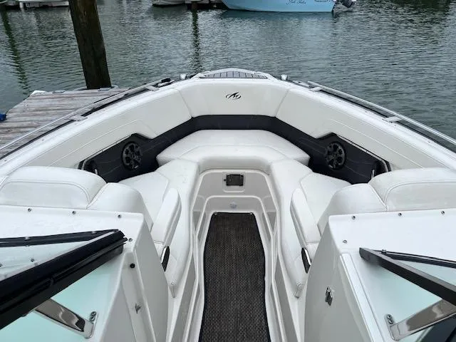 Slide: The Image of 2014 Monterey 268 Super Sport boat interior with white seating at dock. - 3