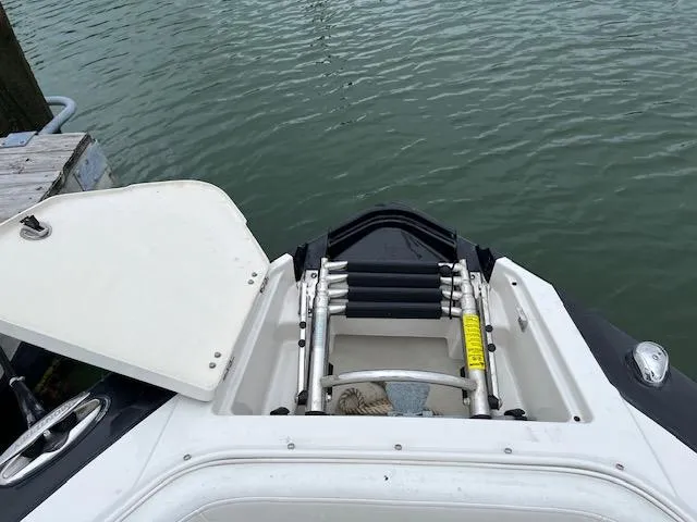 Slide: The Image of 2014 Monterey 268 Super Sport boat with swim ladder and open hatch. - 4