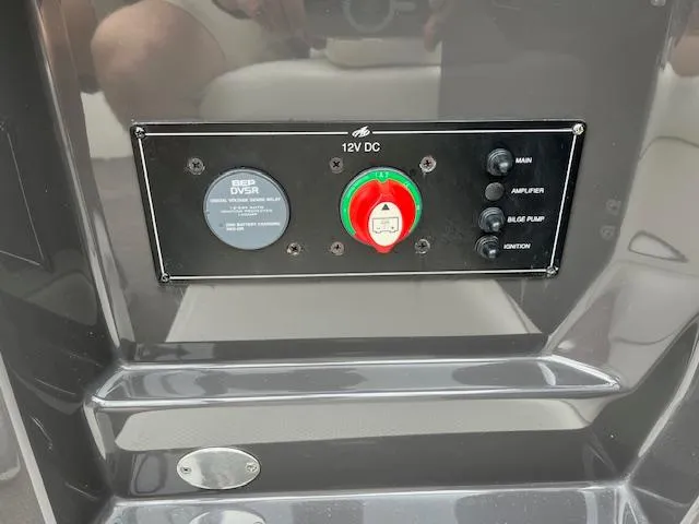 Slide: The Image of Control panel of a 2014 Monterey 268 Super Sport boat with 12V DC switches. - 8