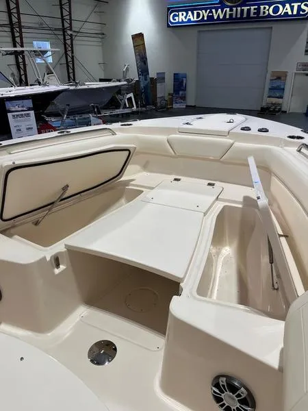 Slide: The Image of 2025 Grady-White CAYNON 271 boat interior, showcasing spacious seating and storage. - 14