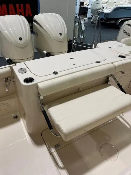 Slide: The Image of 2025 Grady-White CAYNON 271 boat with Yamaha engines, featuring a foldable seat. - 15