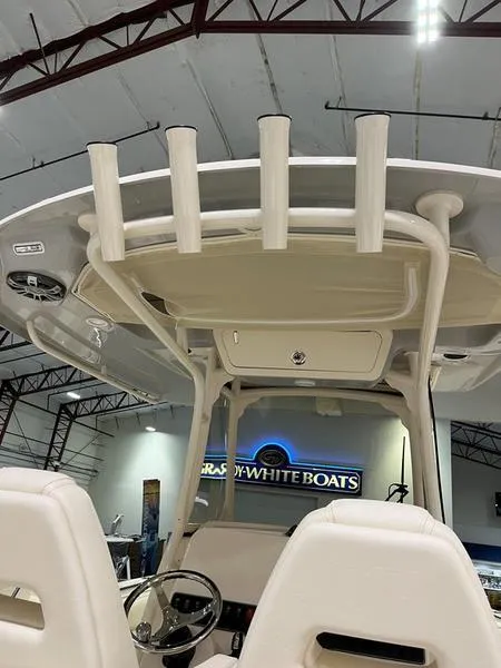 Slide: The Image of 2025 Grady-White CAYNON 271 boat interior with rod holders and helm station. - 16