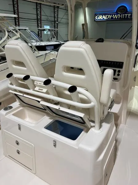 Slide: The Image of 2025 Grady-White CAYNON 271 boat interior with dual seats and rod holders. - 4