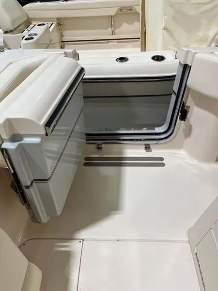 Slide: The Image of 2025 Grady-White CAYNON 271 boat interior with open storage compartment. - 7