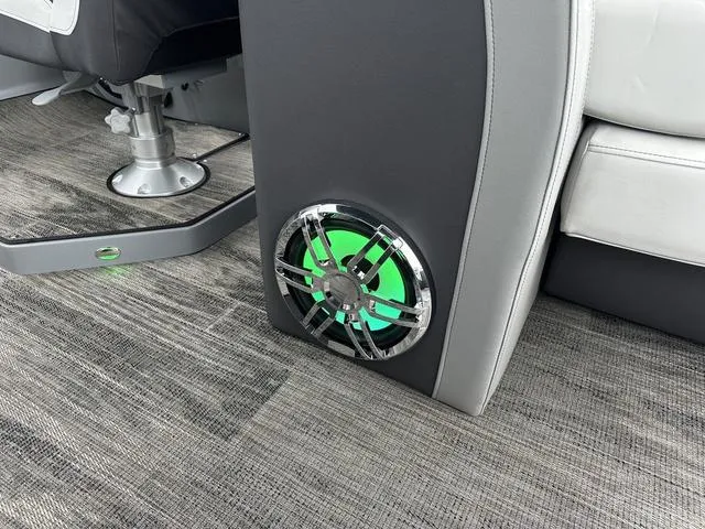 Slide: The Image of Interior of 2025 Godfrey AP 255 SBC boat with stylish flooring and speakers. - 14