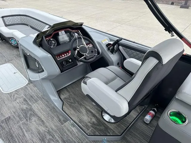 Slide: The Image of Quilted seat and cup holder in 2025 Godfrey AP 255 SBC boat interior. - 15