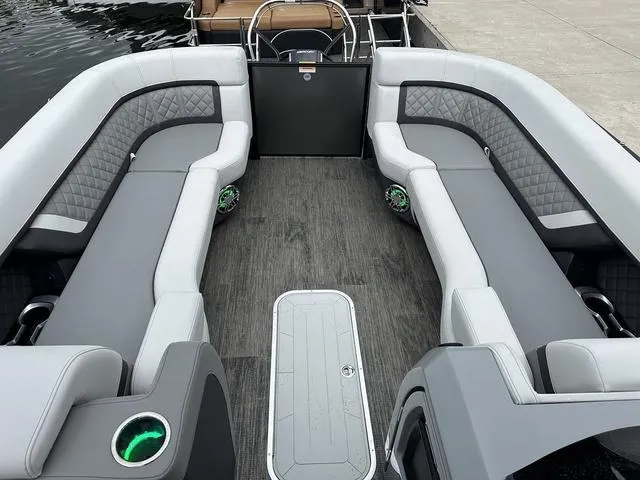 Slide: The Image of 2025 Godfrey AP 255 SBC boat interior with modern steering console and seating. - 18
