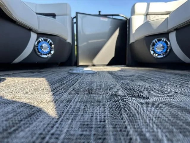 Slide: The Image of Luxurious seating area on 2025 Godfrey AP 255 SBC boat with cup holders and table. - 31