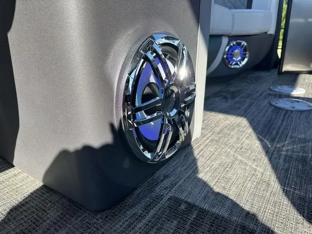 Slide: The Image of Underneath view of a 2025 Godfrey AP 255 SBC pontoon boat on wooden blocks. - 32