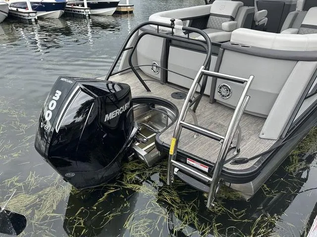 Slide: The Image of Luxurious 2025 Godfrey AP 255 SBC boat interior with illuminated dashboard and plush seating. - 9