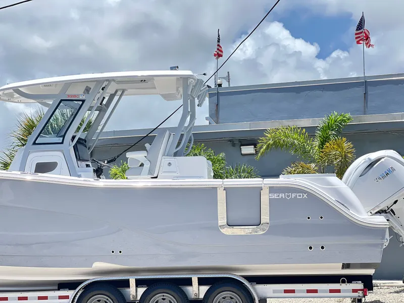 Slide: The Image of 2025 Sea Fox 328 Commander boat on a trailer, side view. - 1