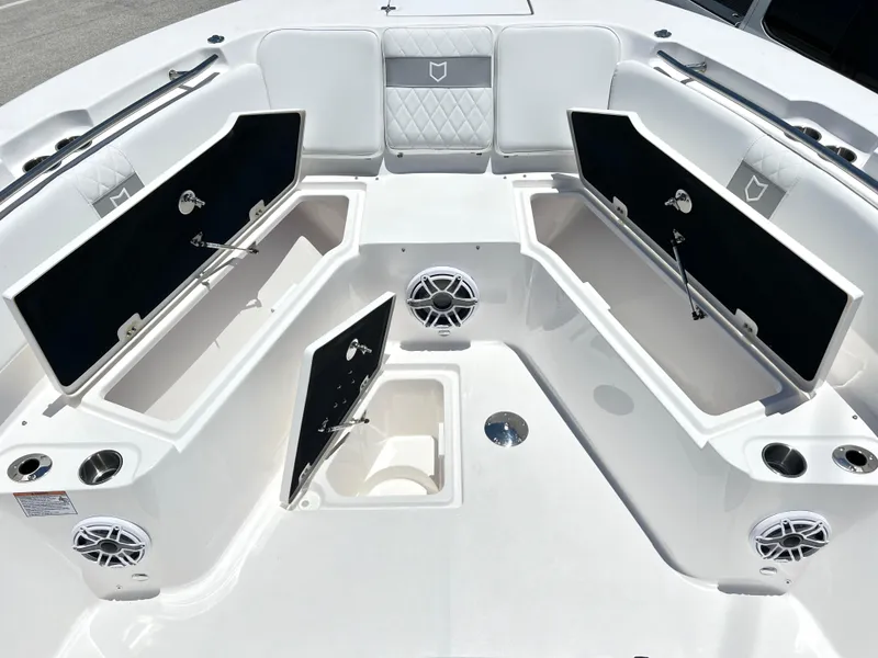 Slide: The Image of 2025 Sea Fox 328 Commander boat with open storage compartments and seating area. - 16