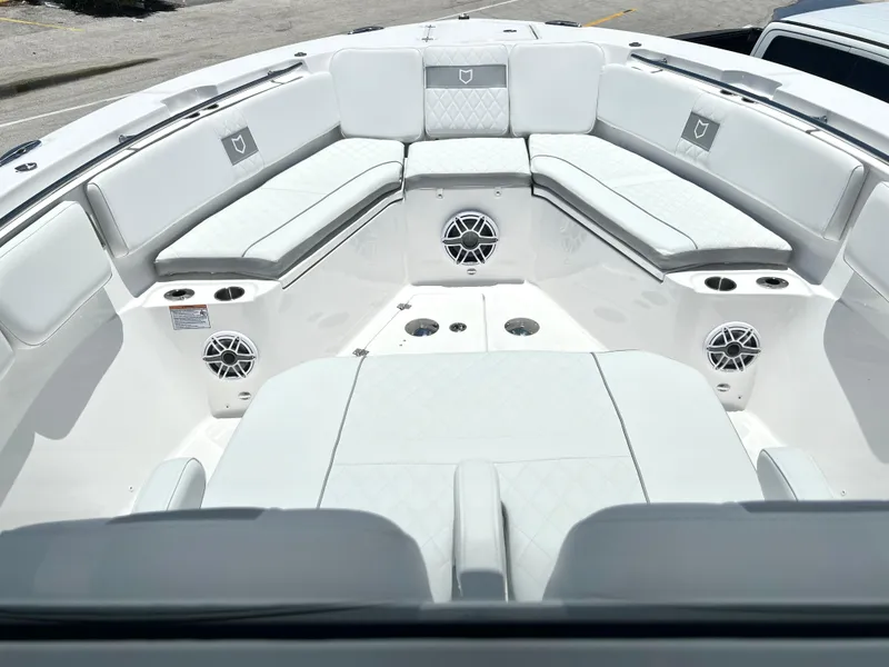 Slide: The Image of 2025 Sea Fox 328 Commander boat interior with white cushioned seating. - 18