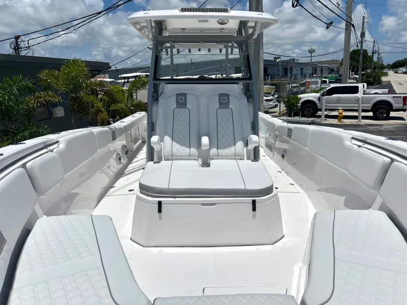 Slide: The Image of 2025 Sea Fox 328 Commander boat interior with white seating and modern design. - 27