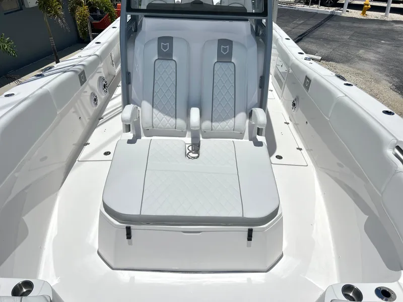 Slide: The Image of 2025 Sea Fox 328 Commander boat interior with dual seats and white upholstery. - 28