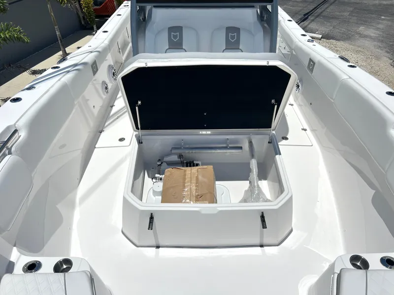 Slide: The Image of 2025 Sea Fox 328 Commander boat with open storage compartment. - 29