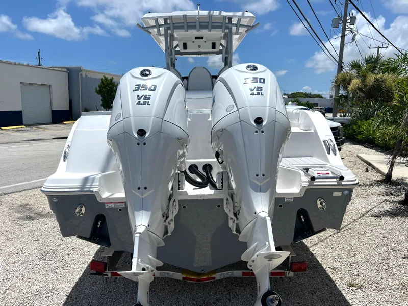 Slide: The Image of 2025 Sea Fox 328 Commander with twin 350 V8 engines, rear view. - 3