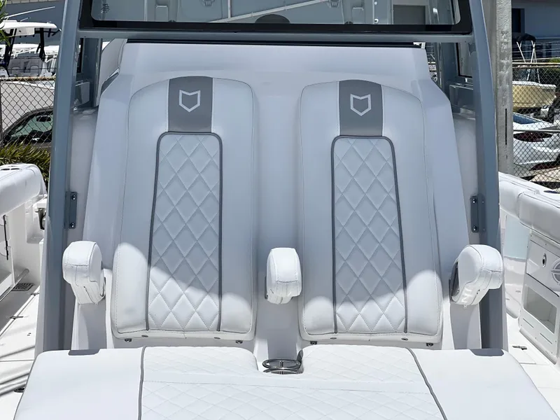 Slide: The Image of 2025 Sea Fox 328 Commander boat with luxurious dual captain's chairs. - 30