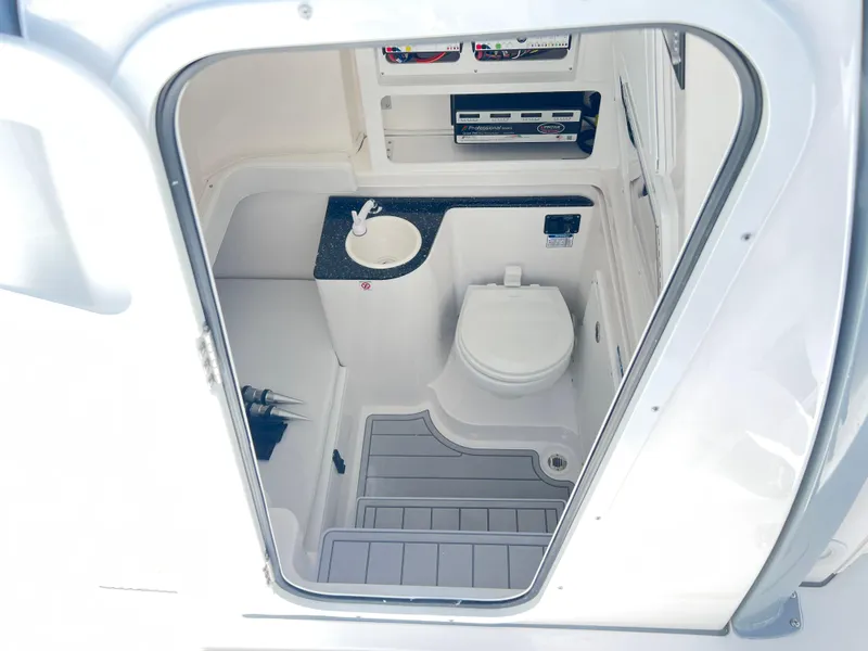Slide: The Image of 2025 Sea Fox 328 Commander boat bathroom with sink and toilet. - 32