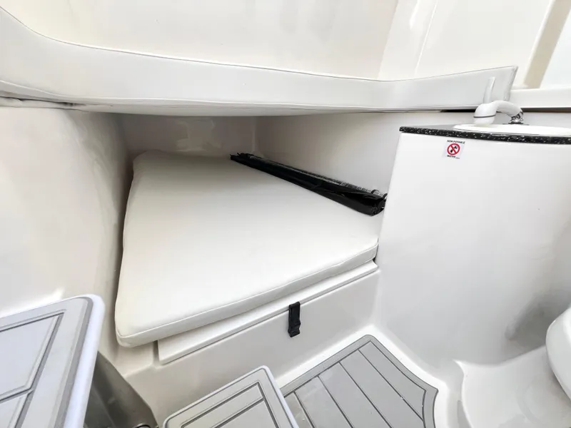 Slide: The Image of 2025 Sea Fox 328 Commander cabin interior with cushioned seating. - 33