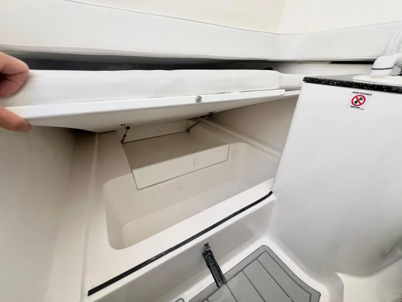 Slide: The Image of 2025 Sea Fox 328 Commander storage compartment and seating area. - 34