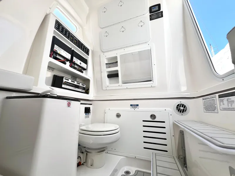 Slide: The Image of 2025 Sea Fox 328 Commander boat interior with toilet and storage compartments. - 36