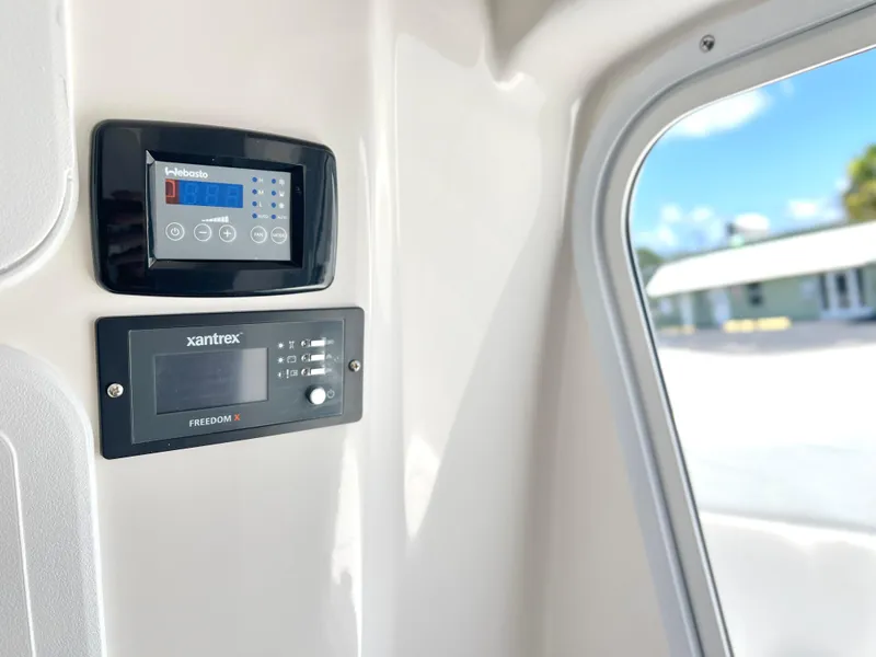 Slide: The Image of Control panel of the 2025 Sea Fox 328 Commander boat with Xantrex and ProMariner displays. - 38