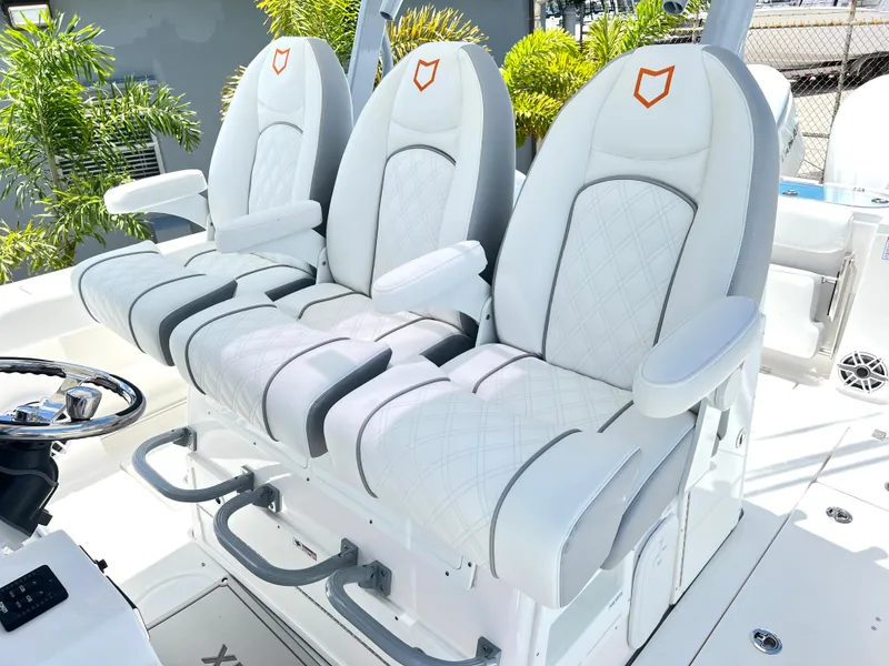 Slide: The Image of 2025 Sea Fox 328 Commander boat with luxurious white seating. - 46