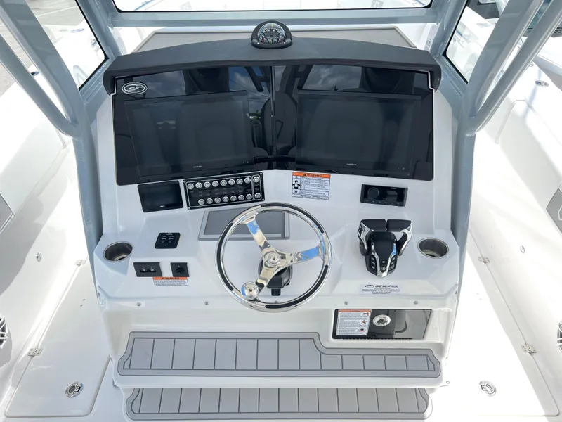 Slide: The Image of 2025 Sea Fox 328 Commander helm with dual displays and modern controls. - 48