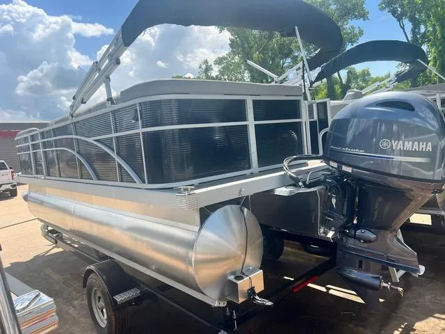 Slide: The Image of 2023 Bennington 208 SL pontoon boat with Yamaha outboard motor. - 6
