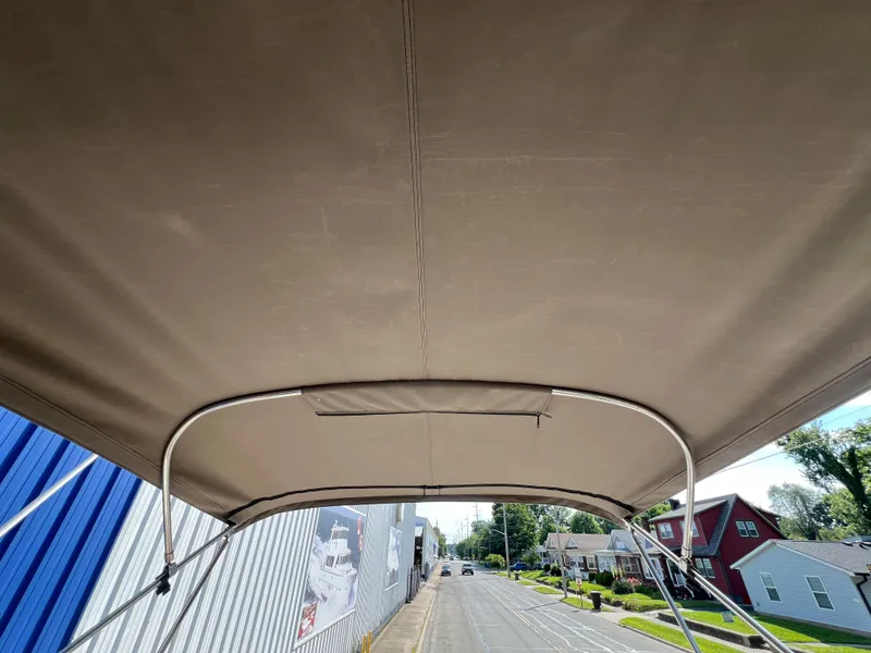 Slide: The Image of Bimini top of 2012 Regal 28 Express boat, street view in background. - 27