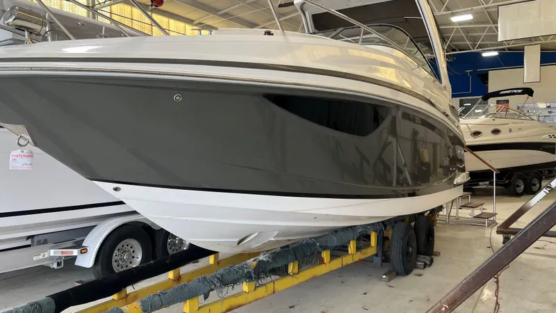 Slide: The Image of 2012 Regal 28 Express boat in indoor storage, side view. - 31