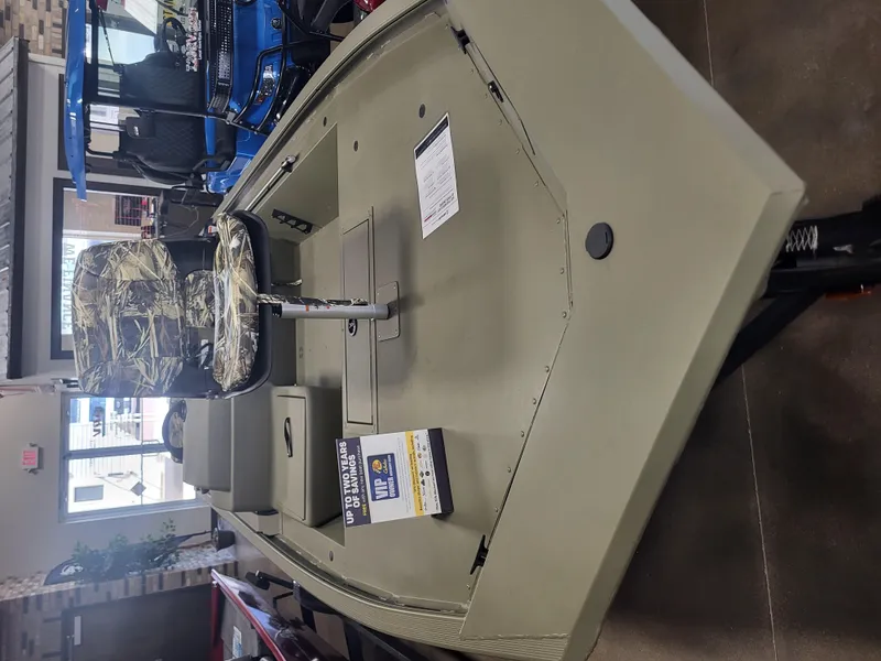 Slide: The Image of 2024 Tracker Grizzly 1754 SC boat on display in showroom. - 5