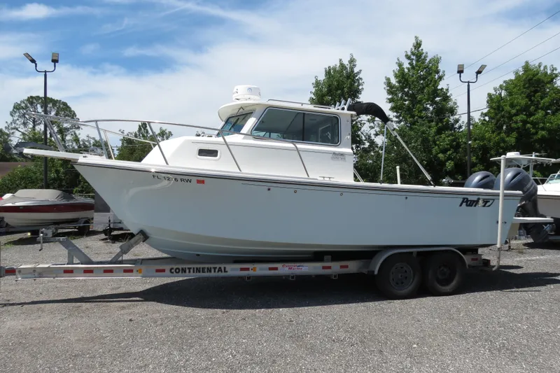 The Image of 2018 Parker 2520 XLD Sport Cabin boat on a Continental trailer. - 1