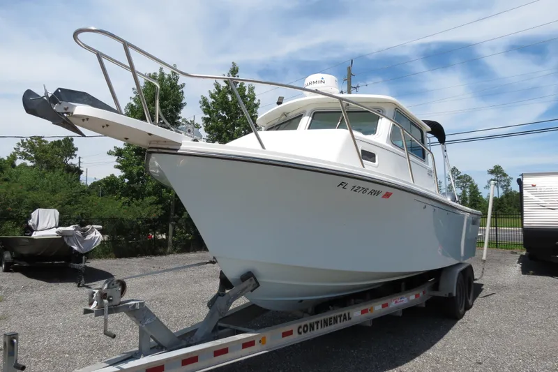 Slide: The Image of 2018 Parker 2520 XLD Sport Cabin boat on Continental trailer. - 10
