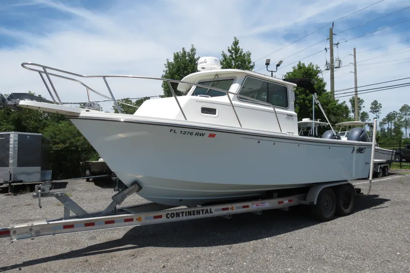 Slide: The Image of 2018 Parker 2520 XLD Sport Cabin boat on a Continental trailer. - 11