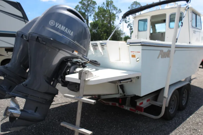 Slide: The Image of 2018 Parker 2520 XLD Sport Cabin boat with Yamaha outboard engines on trailer. - 13