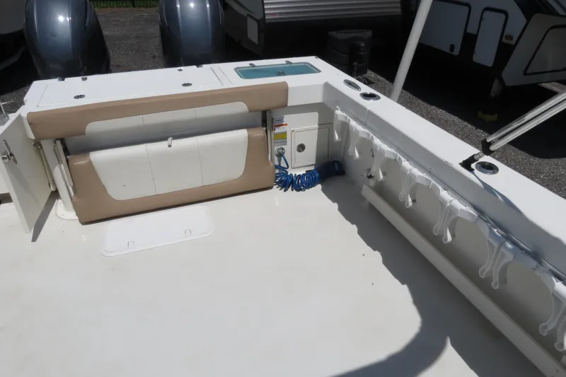 Slide: The Image of 2018 Parker 2520 XLD Sport Cabin boat deck with storage and seating. - 14