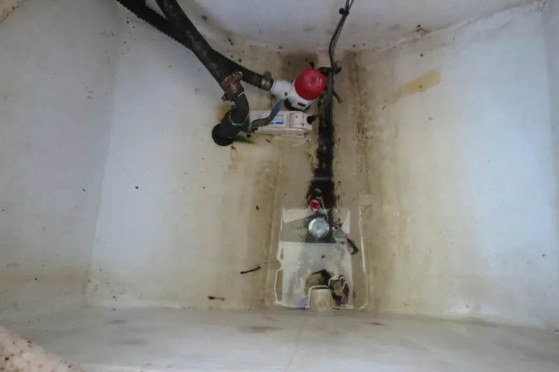 Slide: The Image of 2018 Parker 2520 XLD Sport Cabin bilge area with hoses and wiring. - 29