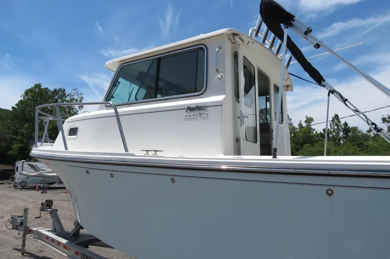 Slide: The Image of 2018 Parker 2520 XLD Sport Cabin boat on a trailer. - 3