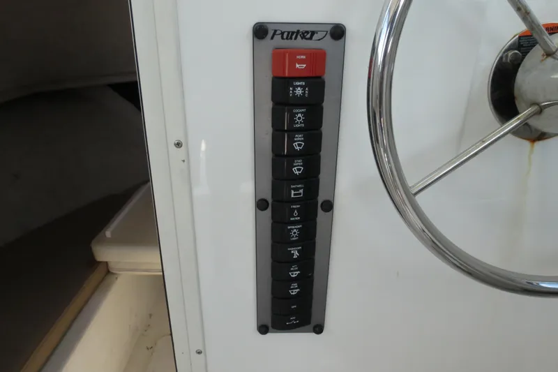 Slide: The Image of Control panel of a 2018 Parker 2520 XLD Sport Cabin boat. - 32