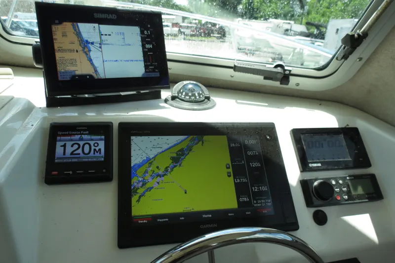 Slide: The Image of Dashboard of a 2018 Parker 2520 XLD Sport Cabin with navigation screens. - 34